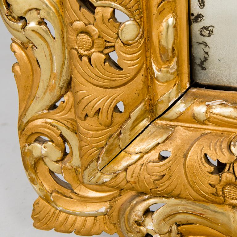 A MIRROR, Baroque style, circa 1900, gilt wood.