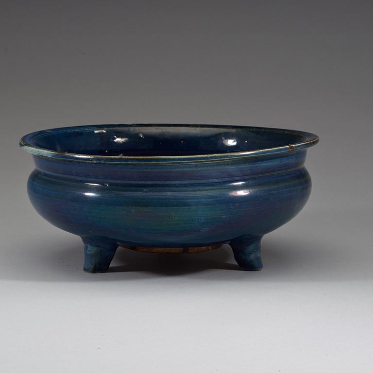 A large blue glazed tripod censer, Qing dynasty (1644-1912).