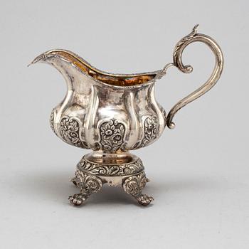 A Russian parcel-gilt silver creamer,  1842, probably Moscow.