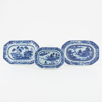 Two blue and white porcelain serving dishes and a stand for a butter tureen, China, Qianlong (1736-95).
