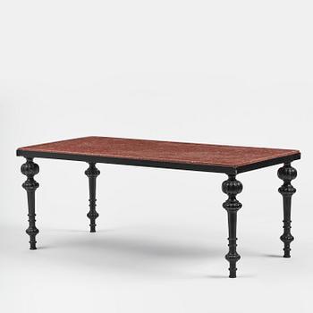 A table with granite stone top from Älvdalen, first part 19th century on a later metal stand.