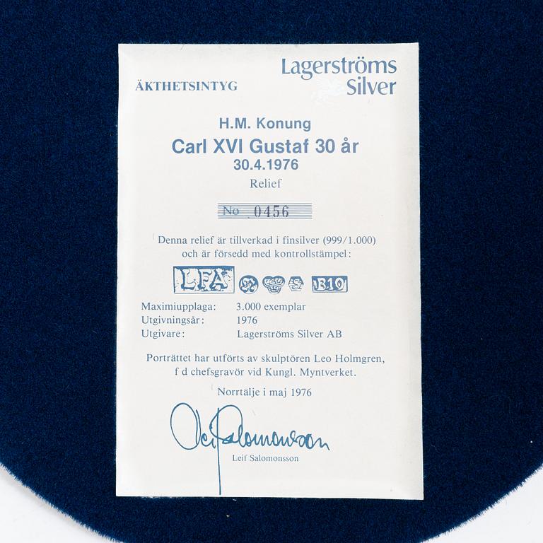 Relief, a pair, silver 999/1000, numbered 456 and 457/3000, Lagerströms Silver AB, Norrtälje 1976.