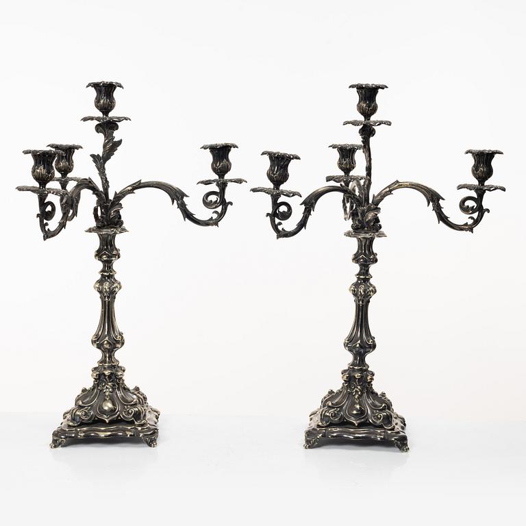 A pair of silver plated Rococo style candelabra, 20th century.