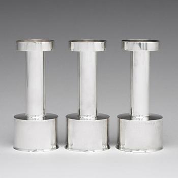 Sigurd Persson, a set of three sterling silver candlesticks, Stockholm 1965 and 1970, executed by Johann Wist.