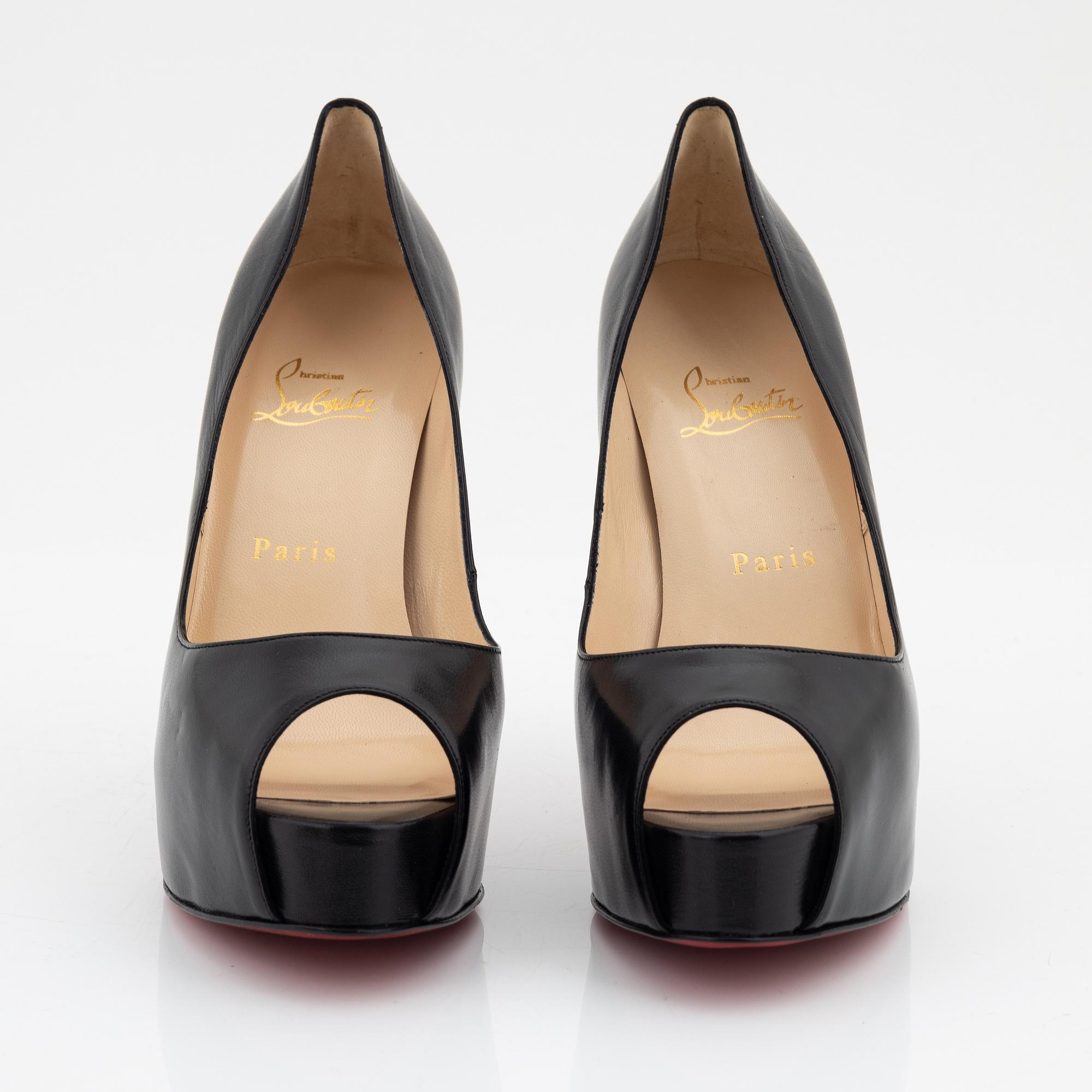 Christian Louboutin, a pair of black leather peep toe pumps, size 37 1/2.