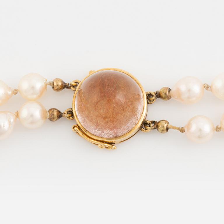 Two strand cultured pearl necklace, 18K gold clasp with rutile quartz.