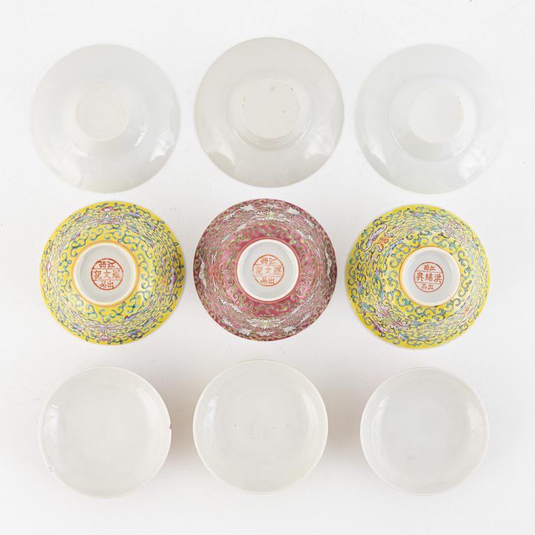 A group of three Chinese enamelled porcelain cups with covers and stands, three small dishes, 20th century.