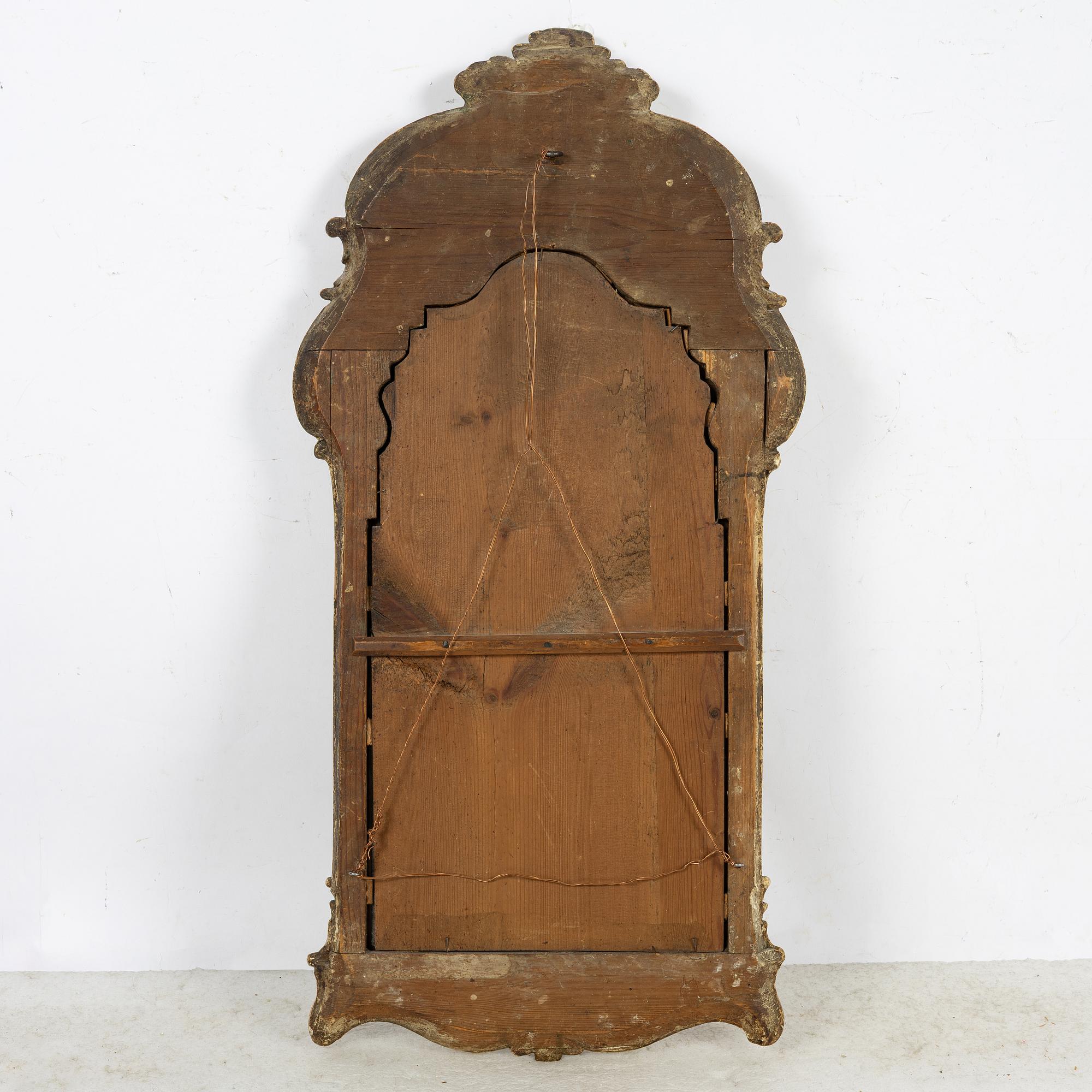 A giltwood rococo mirror, Stockholm, mid 18th century.