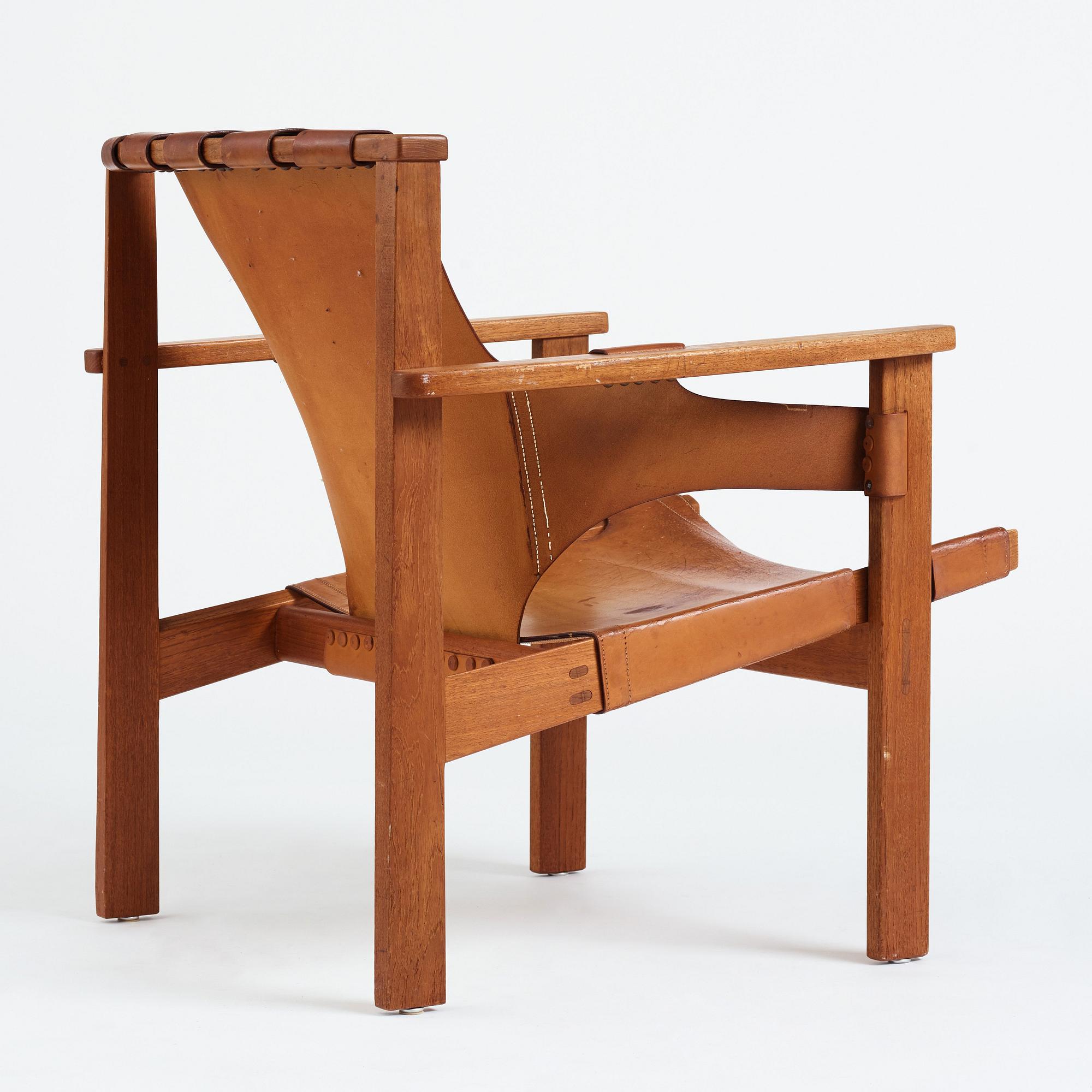 Carl-Axel Acking, a "Trienna" oak and natural leather easy chair, for Nordiska Kompaniet, Sweden 1960's.