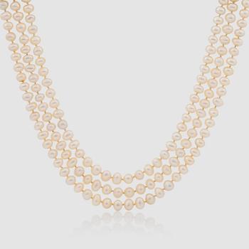 1254. A 3-strand cultured pearl necklace. Clasp with a cabochon-cus emerald and brilliant-cut diamonds.