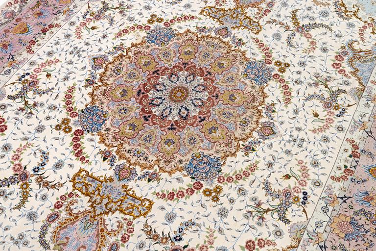 A Tabriz carpet north west Persia, part silk, c. 314 x 197 cm.