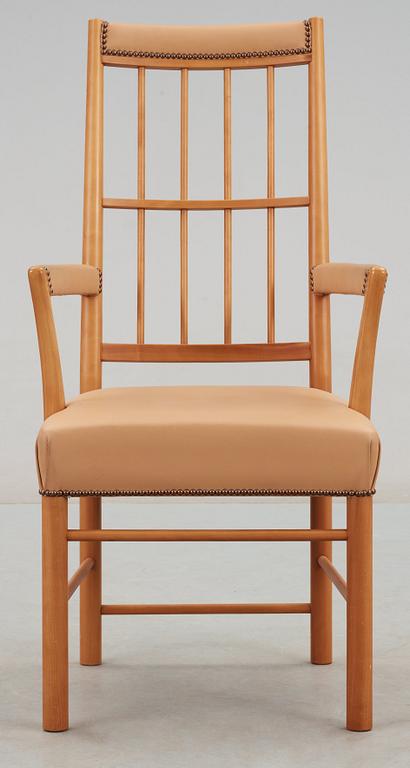 A Josef Frank cherry and beige leather armchair, Svenskt Tenn 2007, model 652.