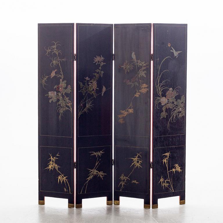 A Chinese lacquered folding screen, 20th century.