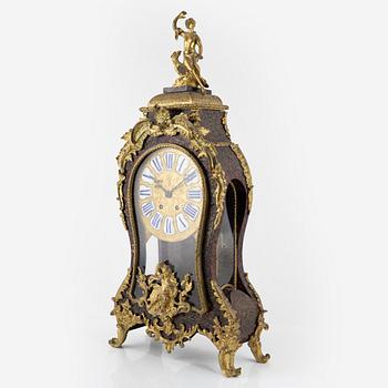 A faux tortoise and gilt bronze-mpunted Louis Xv-style cartel clock, late 19th century.