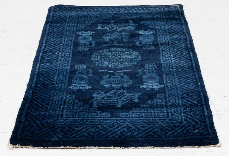 An antique Baotou, rug north China, c. 140 x 70 cm.