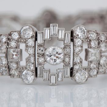 An Art Déco old- and baguette-cut diamond bracelet. Total carat weight of diamonds circa 15.00 cts.