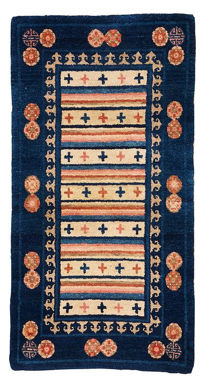 A rug, semi-antique Baotou, ca 108,5 x 56,5 cm.