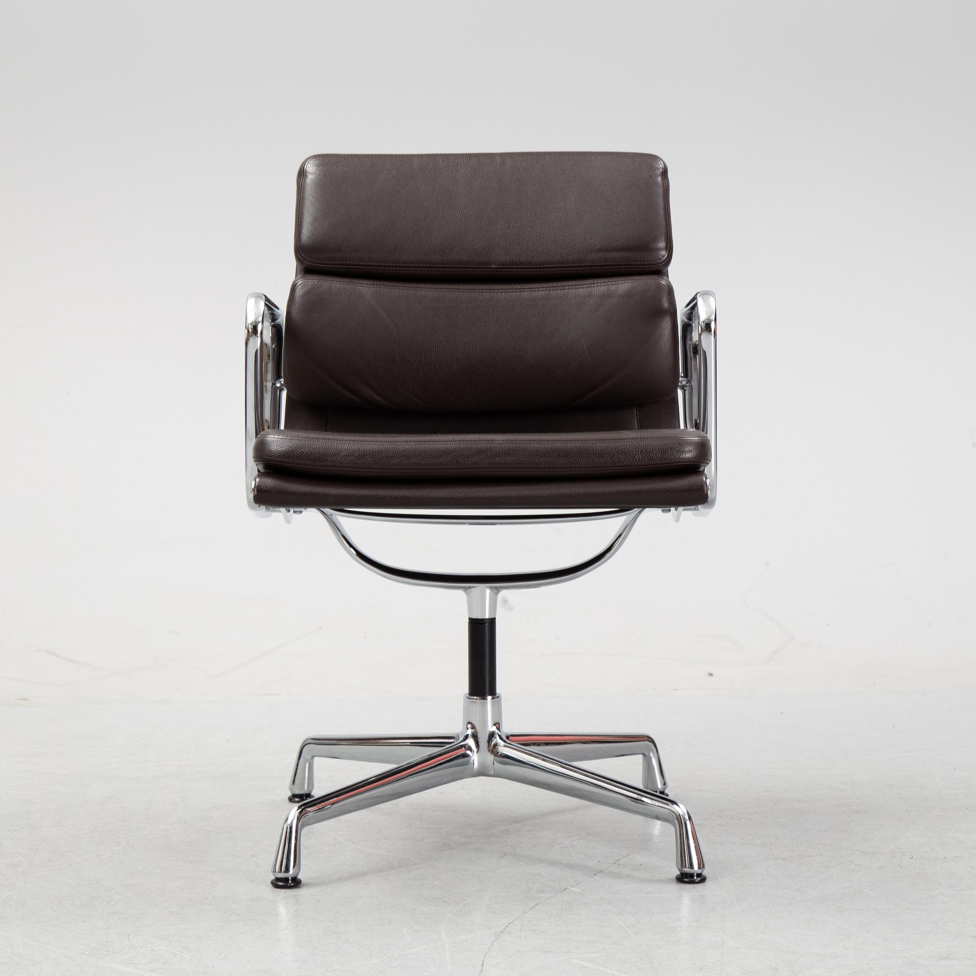 An EA 208 Soft Pad swivel chair by Charles and Ray Eames for Vitra, dated 2010.