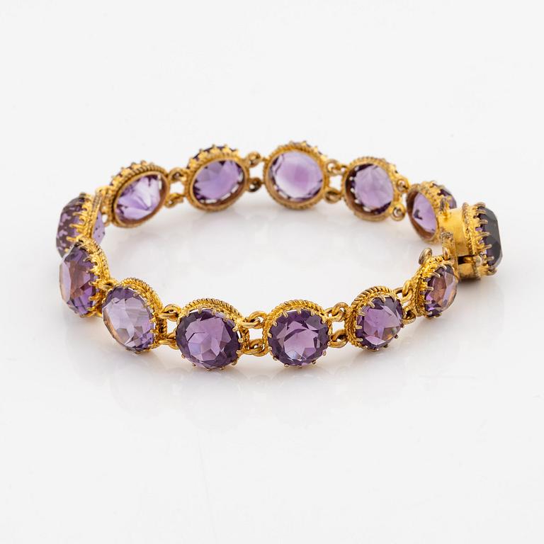 A necklace and a bracelet of gilded silver with faceted amethysts.