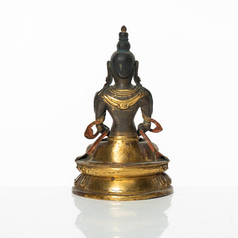 A gilt copper figure of Amitayus, Tibeto-Chinese, 18th Century.