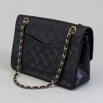 CHANEL, a black leather shoulder bag, "Double Flap".