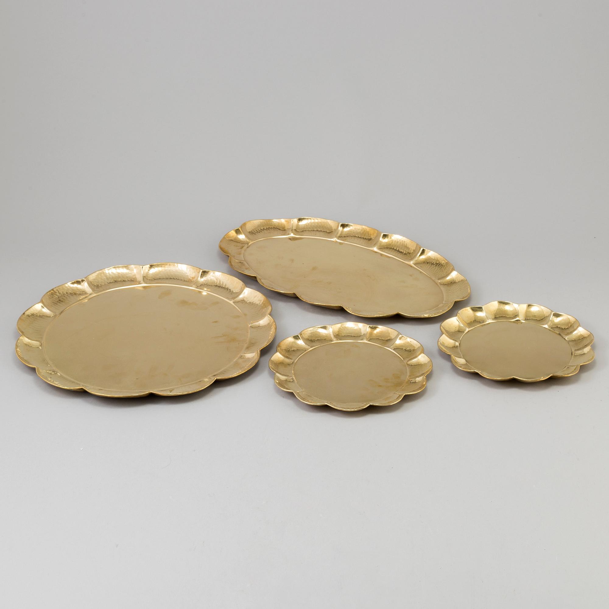 A set of four brass plates by Ture Henrikson, Arvika.