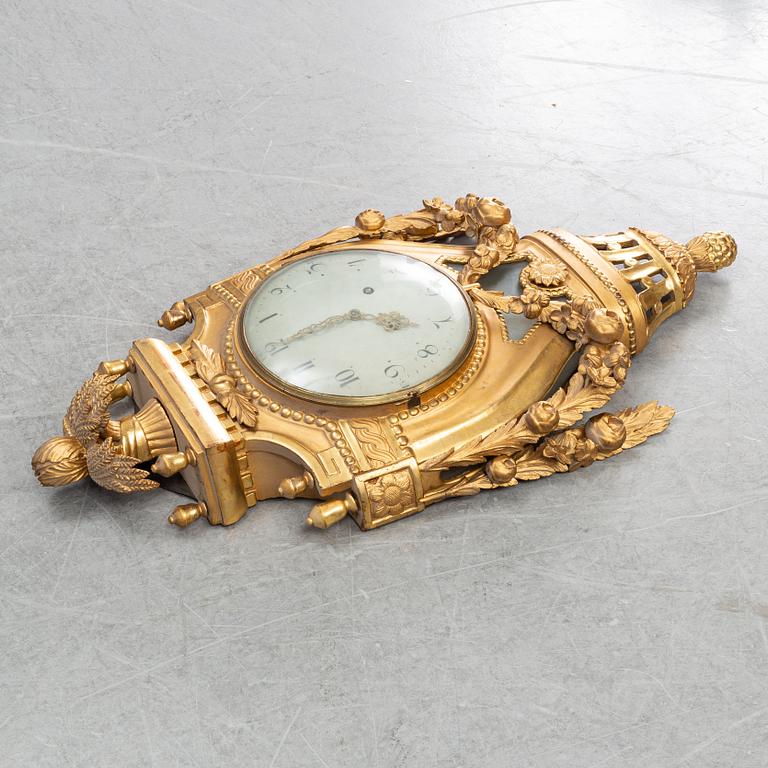 A Gustavian pendulum wall clock.