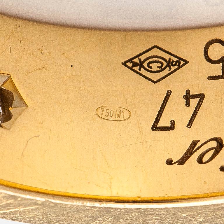 Cartier, an 18K gold 'Love' ring with three brilliant-cut diamonds.