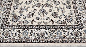 A part silk Nain carpet, ca 305 x 198 cm.