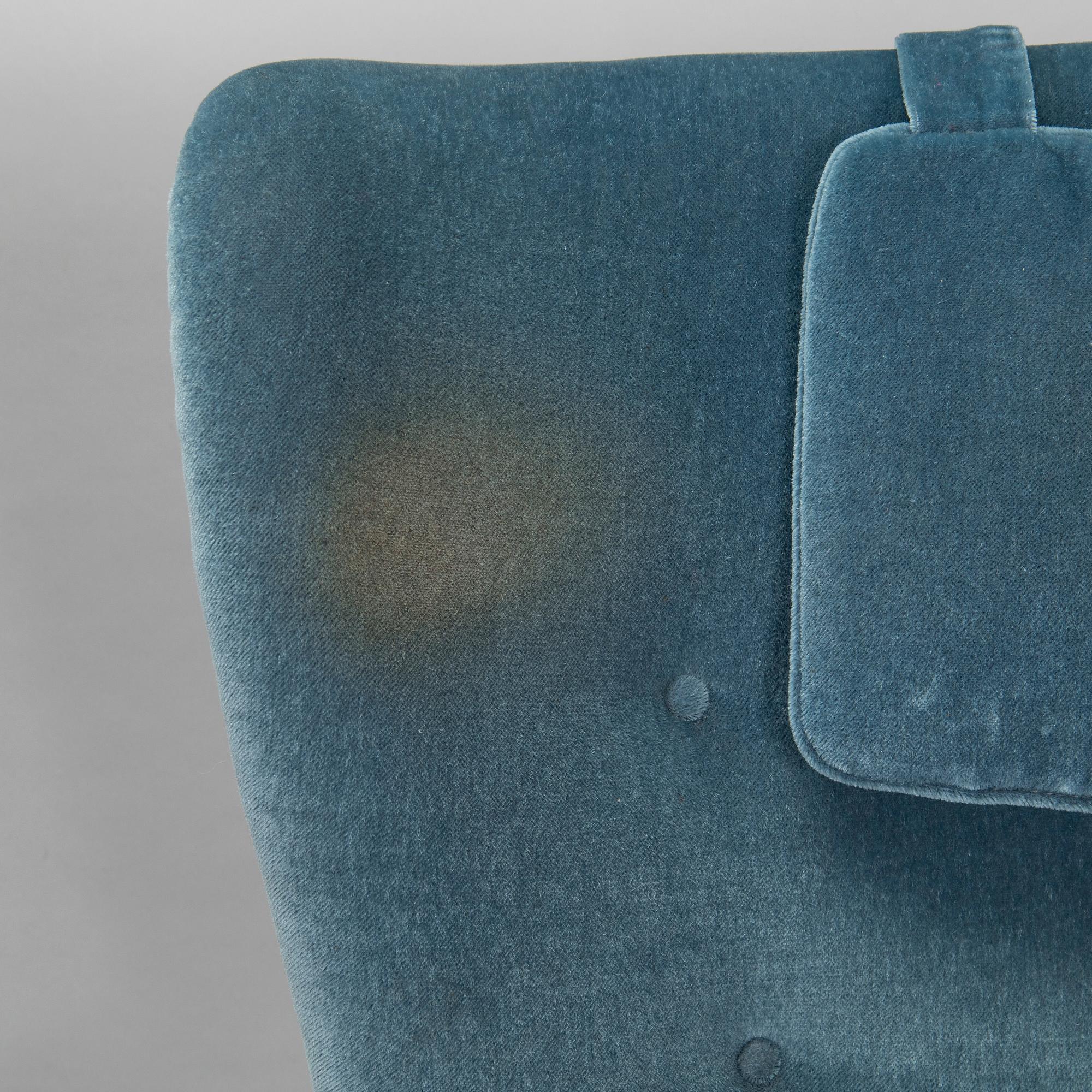 A pair of mid-20th century armchairs.