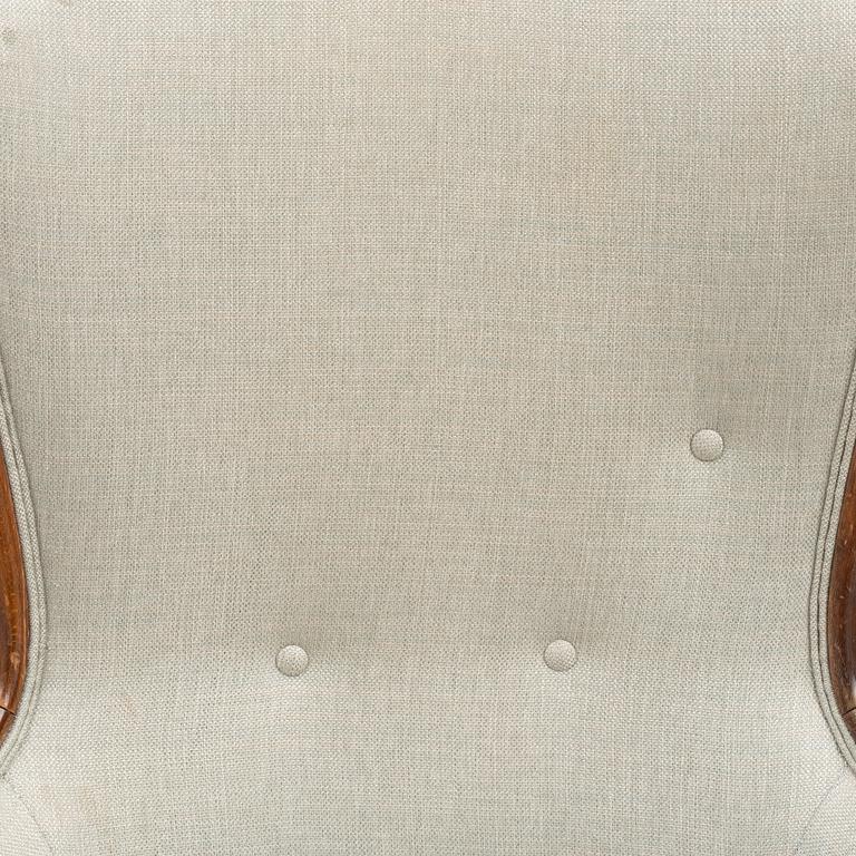 A pair of similar Swedish Modern armchairs, mid 20th century.