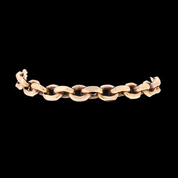 An 18K gold anchor link bracelet.