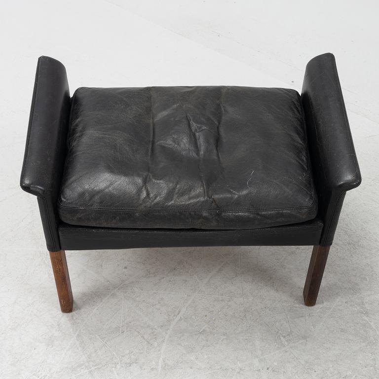 Hans Olsen,  a black leather easy chair with a stool, CS Möbler, Denmark, 1950's-60's.