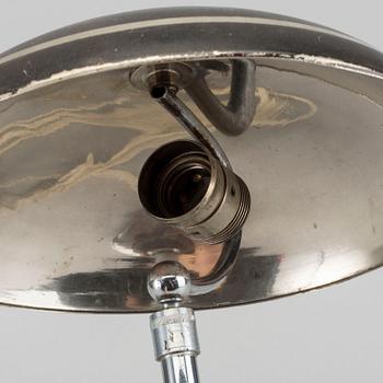 A 1930's white metal table lamp.