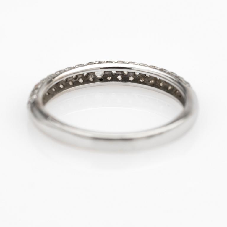 Ring, 14k white gold with brilliant-cut diamond and white stones.
