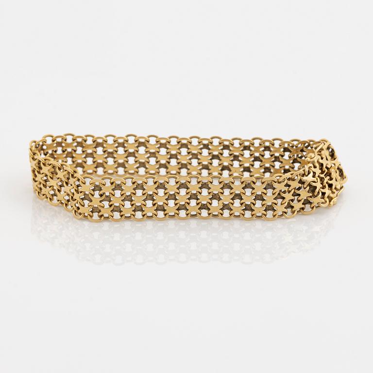 An 18K guld bracelet.