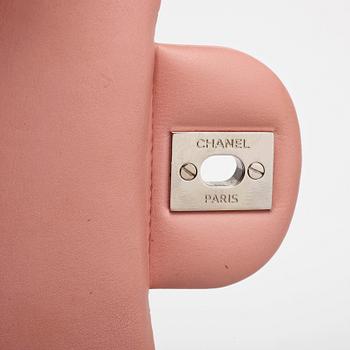 CHANEL, a mini pink quilted patent crossbody bag.