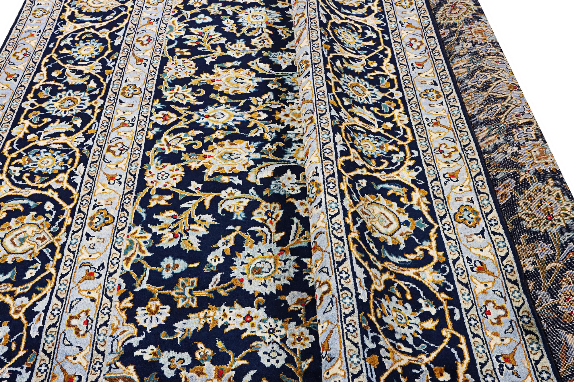 A Kashan carpet, c. 343 x 236 cm.