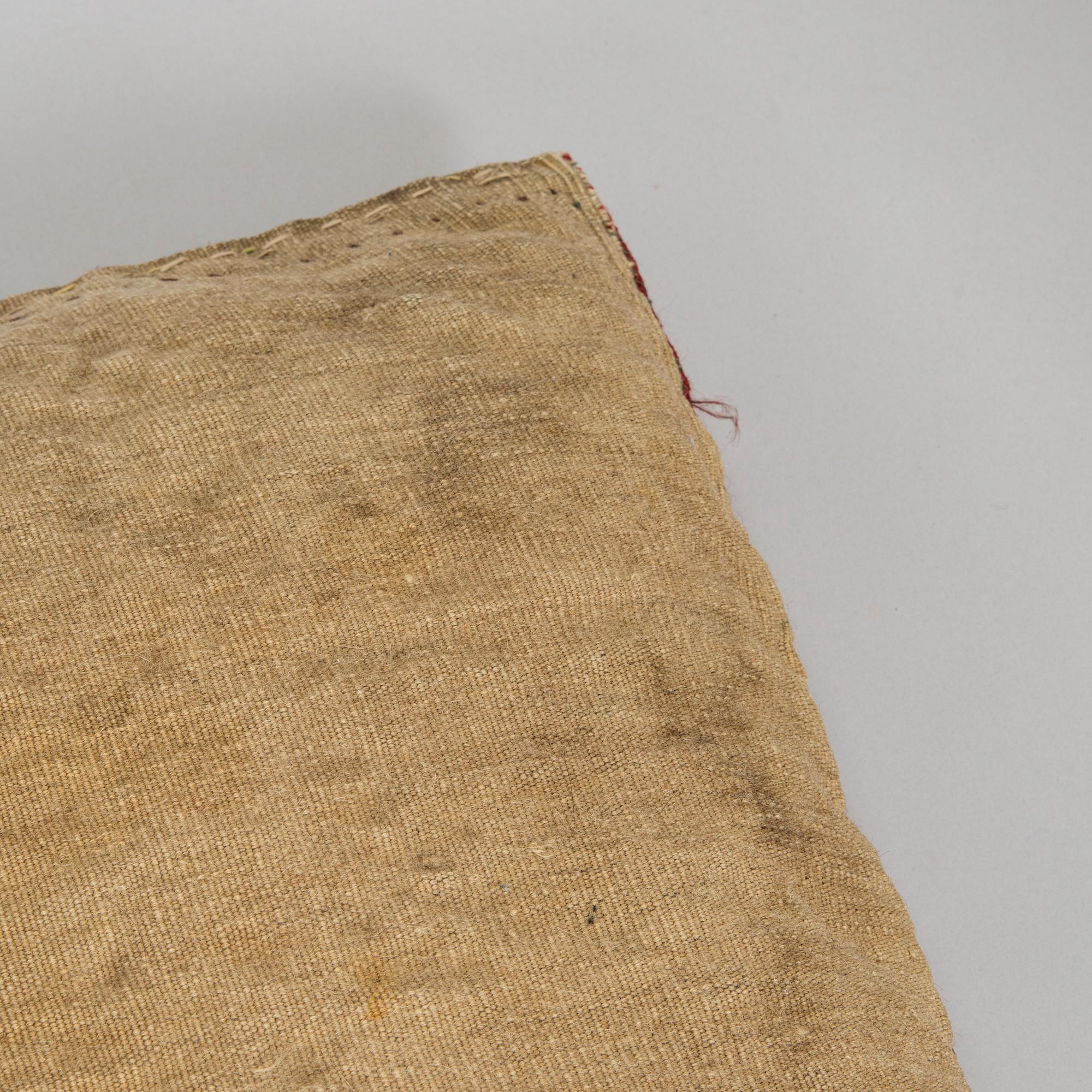 Two presumably antique Turkmenistan Yomud cushions/bag fronts.