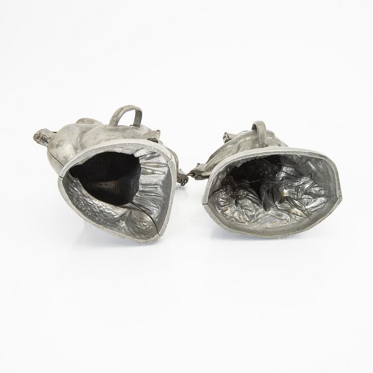 A set of four pewter icecream moulds around 1900.