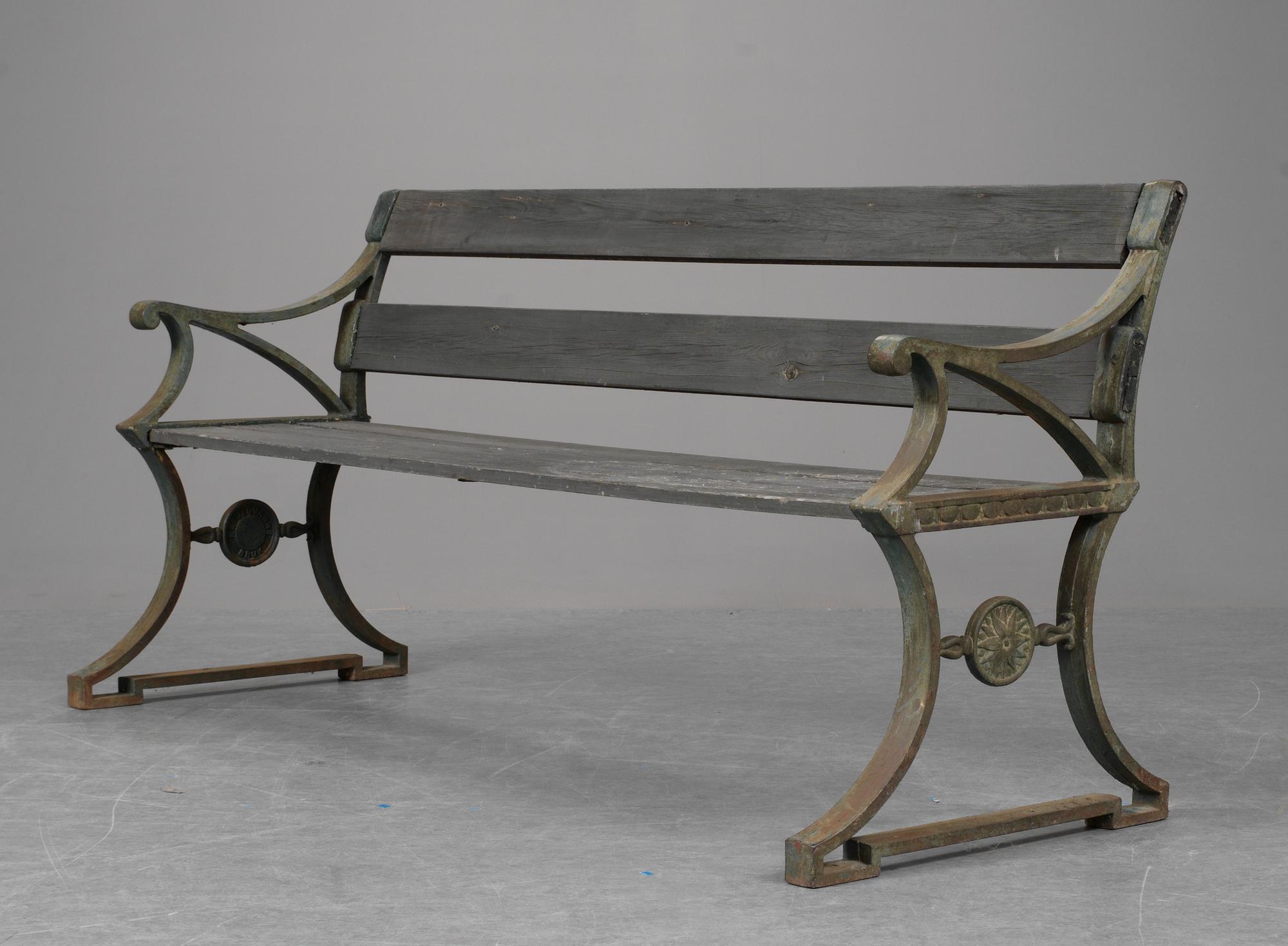 A Folke Bensow cast iron and wood park sofa, Näfveqvarns Bruk.