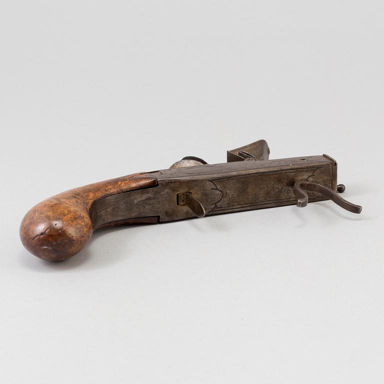 A FLINTLOCK LIGHTER, iron, 18th century.