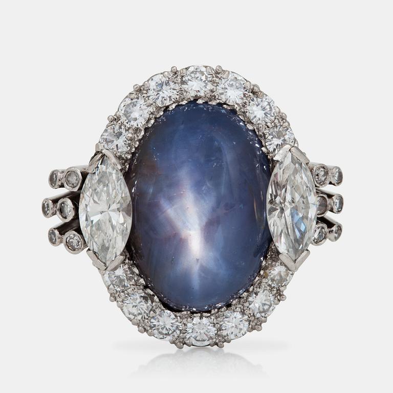 A cabochon-cut star sapphire and diamond ring.