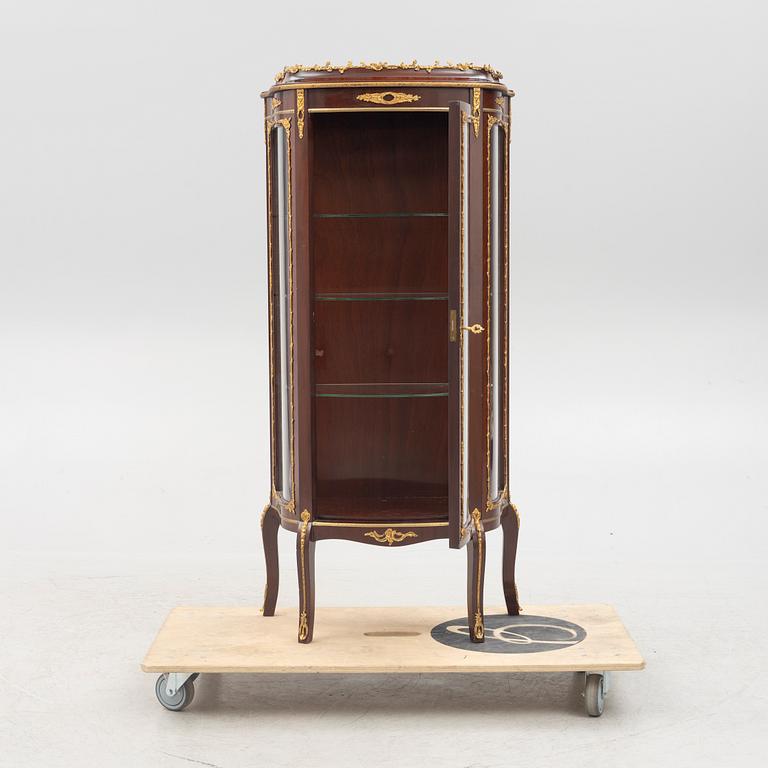 A vitrine cabinet, mid-20th century.