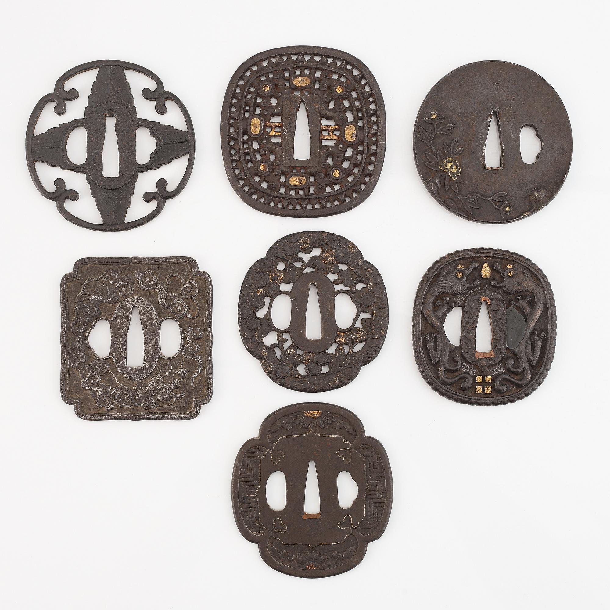 Seven tsuba of different origin, 18th - 20th Century.