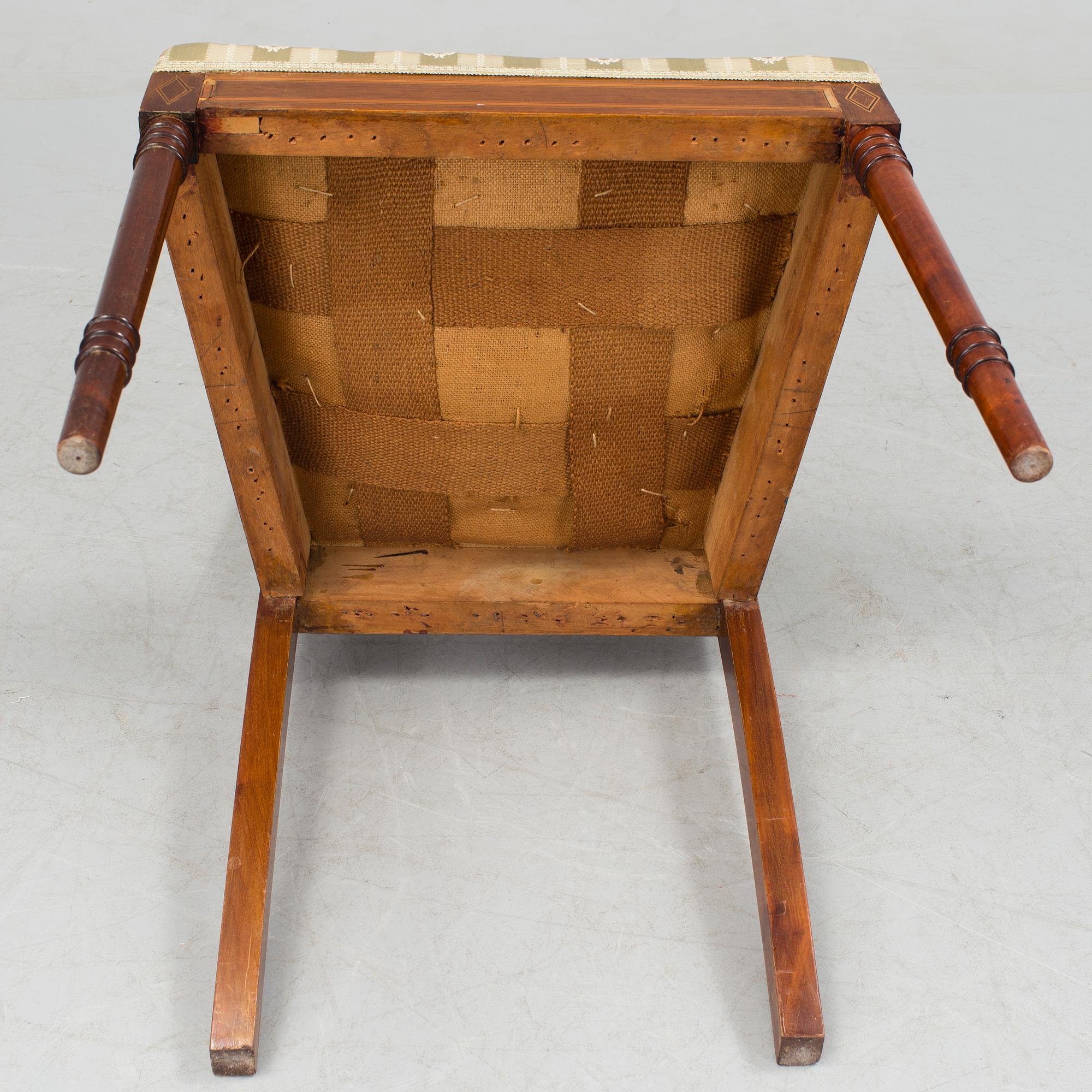 A 1920/30s Swedish Grace sofa, a pair of chairs, a pair of armchairs and a table veneered with mahogany.