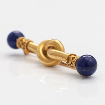 An 18K gold brooch, needle 14K gold, with lapiz lazuli.