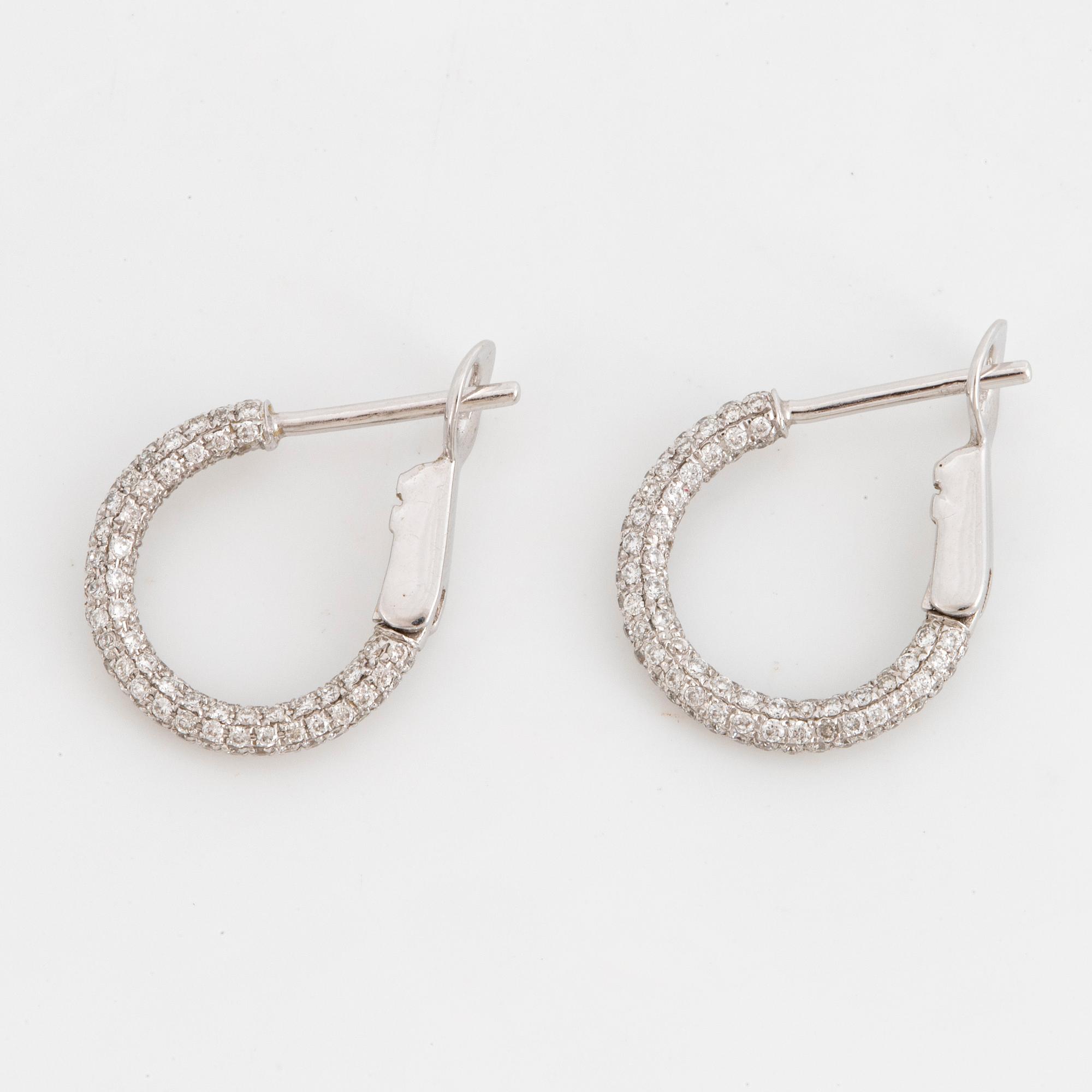 Brilliant-cut diamond pavé earrings.
