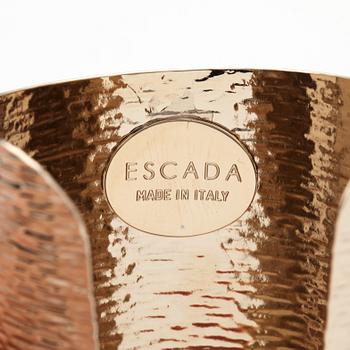 ESCADA, a golden metal bracelet.
