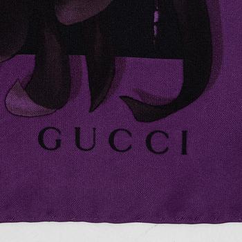 Gucci, a silk scarf.